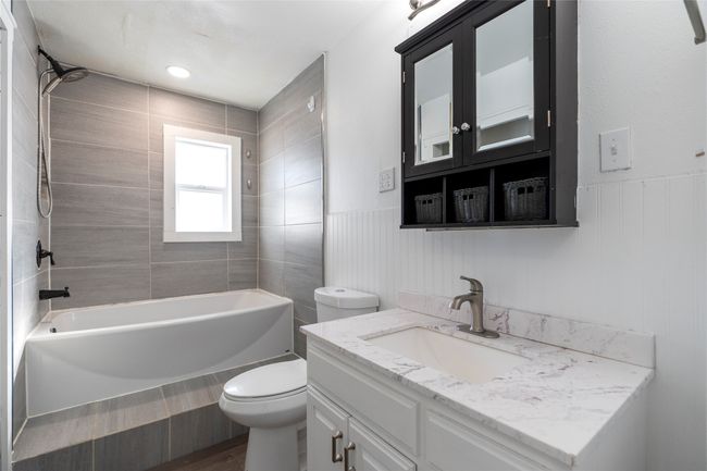 Marble-style vanity with extra storage. | Image 41
