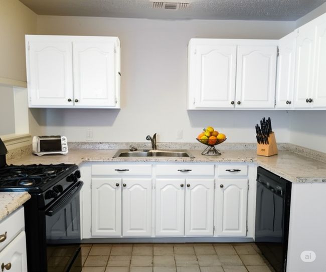 Kitchen with black appliances, white cabinets, and light tile patterned flooring | Image 11