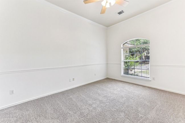 Another view of front office/bedroom with ample light from large front window | Image 10