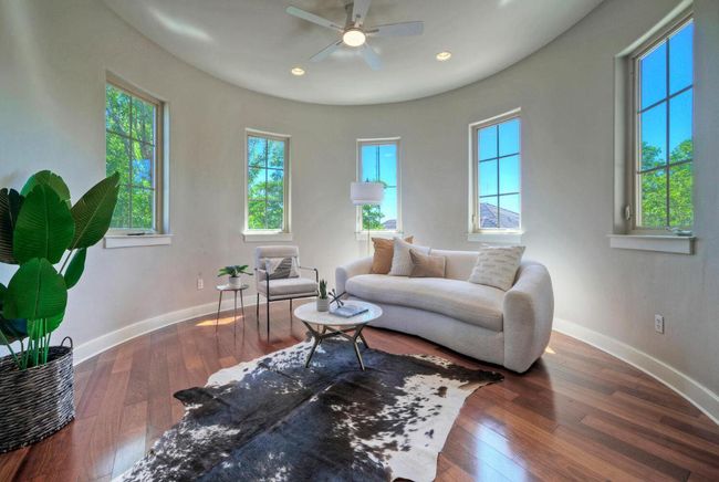 Rotunda secondary living room with wood flooring, baseboards, a ceiling fan, recessed lighting and ample natural light | Image 28