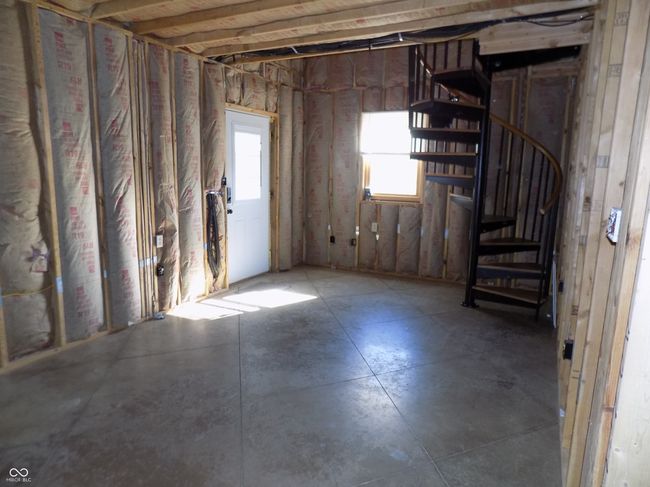 View from Kitchen of Front Door & Living Room. Spiral Stairs to Loft | Image 4