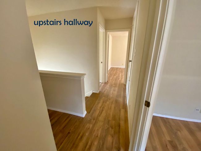 Corridor featuring an upstairs landing, vinyl floors | Image 11