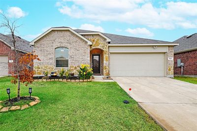 View of front of property with a front lawn and a garage | Image 1