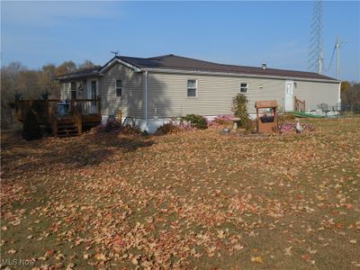 Rear view of property with a deck | Image 1