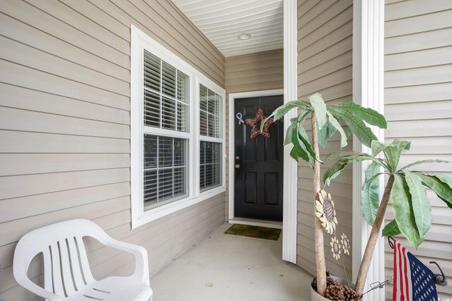 View of exterior entry featuring a porch | Image 4