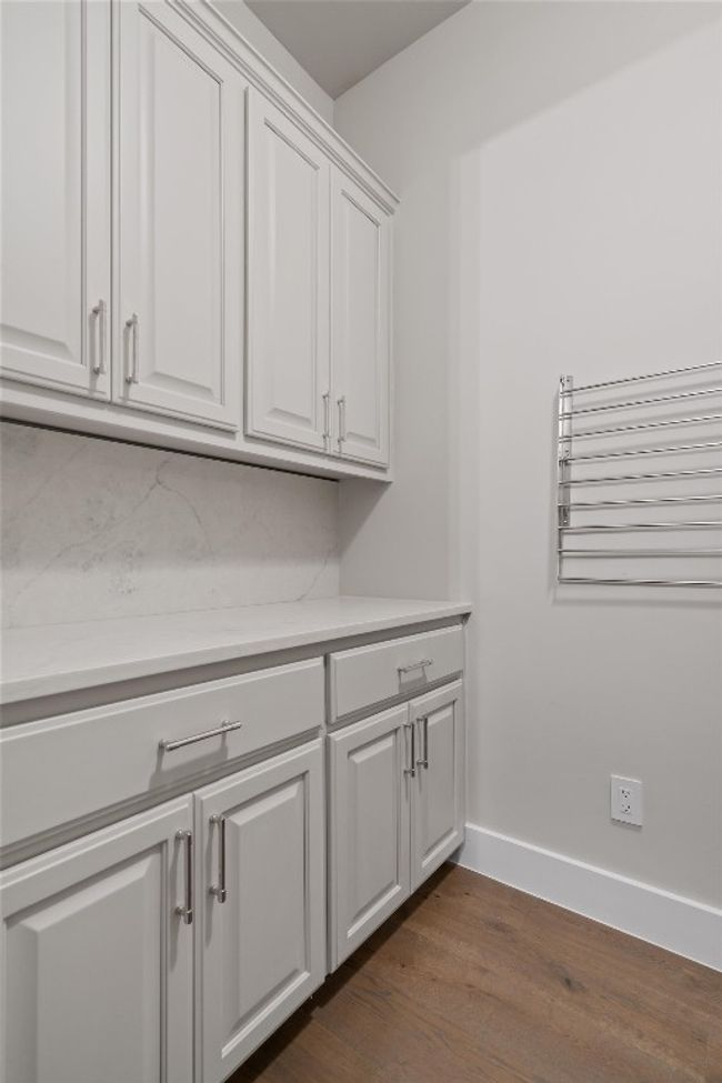 Laundry area with plenty of storage | Image 15