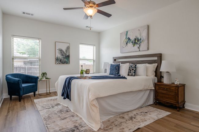 Bedroom featuring wood finished floors and a ceiling fan | Image 13