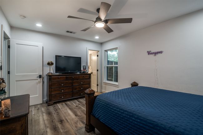 Bedroom with wood finished floors, recessed lighting, and a ceiling fan | Image 26