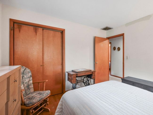 Bedroom featuring a closet and light hardwood / wood-style floors | Image 26