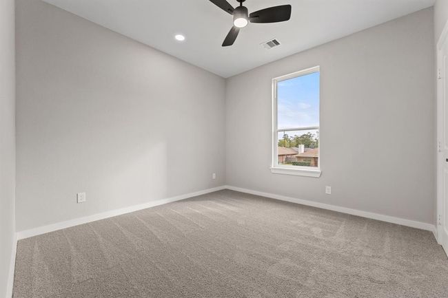 First bedroom with ample space. Whether for a guest room or home office, this bright room is versatile for your needs. | Image 12