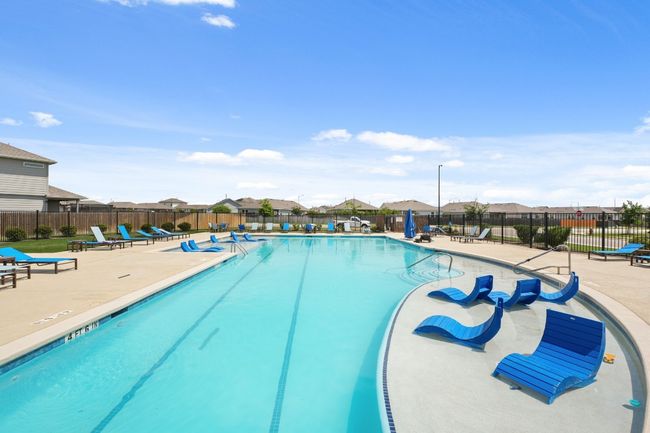 Community pool featuring a patio area and a residential view | Image 39
