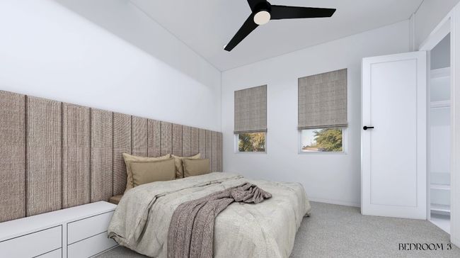 Bedroom with ceiling fan and carpet floors | Image 10