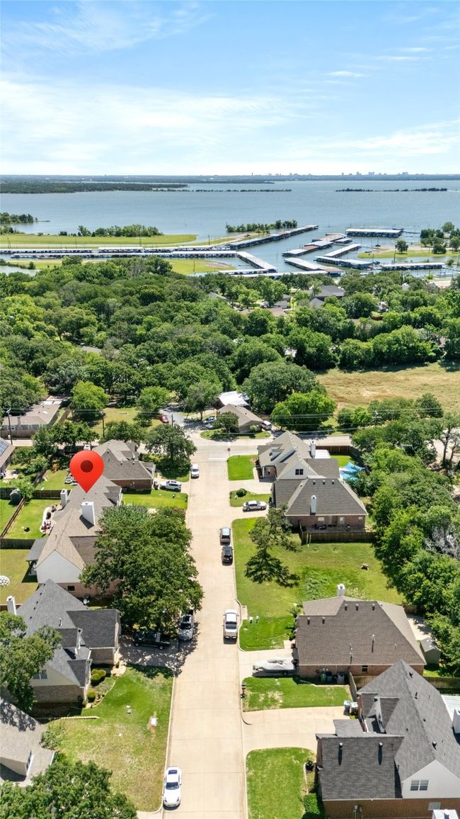 Aerial view of residential area featuring a nearby body of water | Image 5
