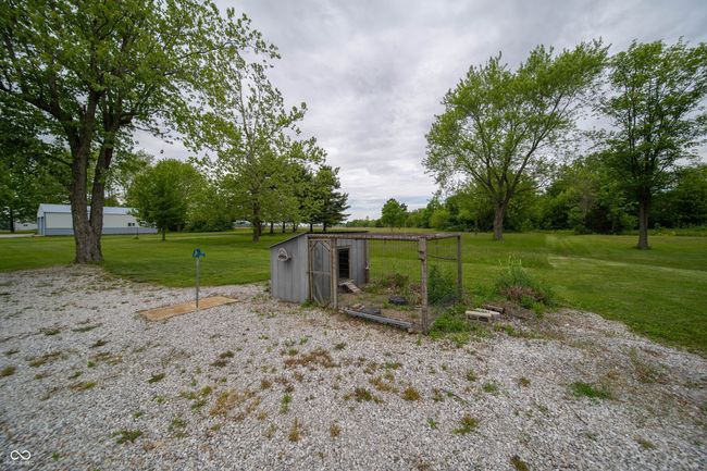 view of grassy yard with an outdoor structure and exterior structure | Image 41