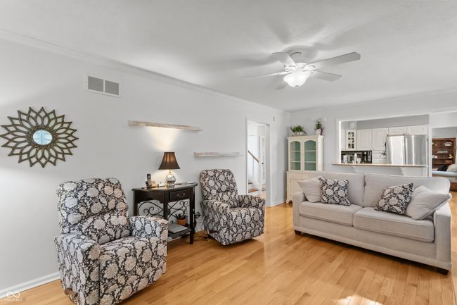 family room open to the kitchen with gas log fireplace. | Image 8