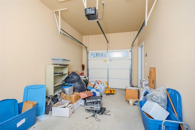 Garage featuring a garage door opener | Image 27