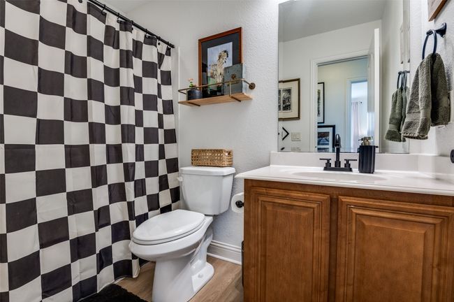 Full bathroom across the hall from two secondary bedrooms. | Image 12