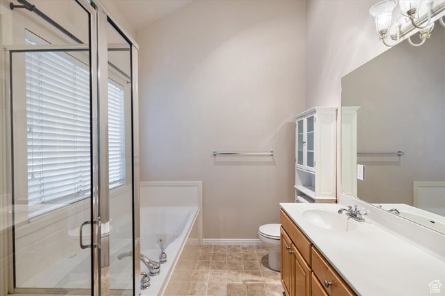 Master Bathroom featuring vanity, a bath, and a stall shower | Image 22