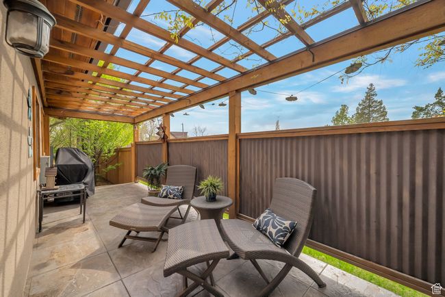 View of patio / terrace with fence and a pergola | Image 12