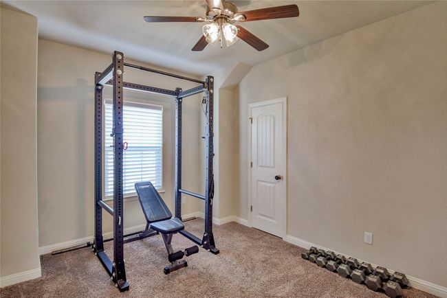 Workout area and Bedroom with carpet, baseboards, and a ceiling fan | Image 28