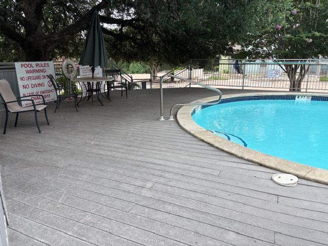 Community pool with a deck | Image 5