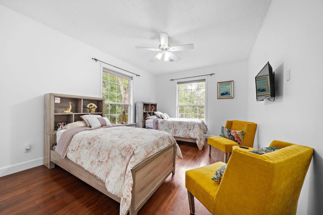 Bedroom with large windows and neutral tones | Image 33