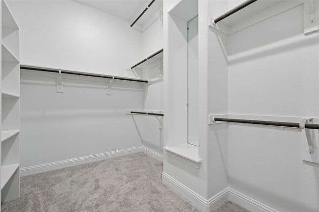 Spacious closet with carpet flooring | Image 24