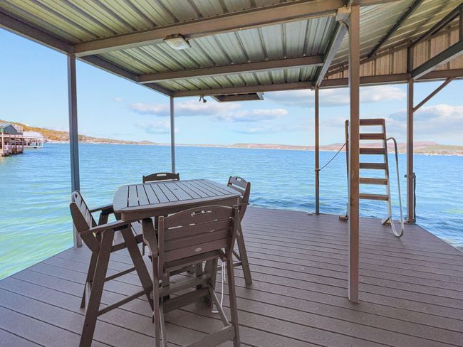 Dock area featuring a water view | Image 13