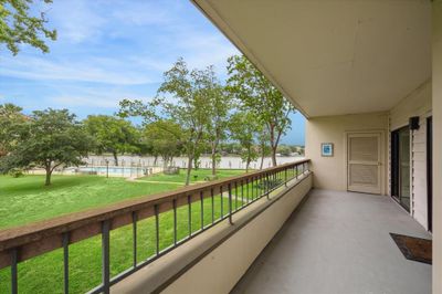 Look forward to spending lots of time on your wrap-around balcony with your waterviews of Clear Creek... | Image 1