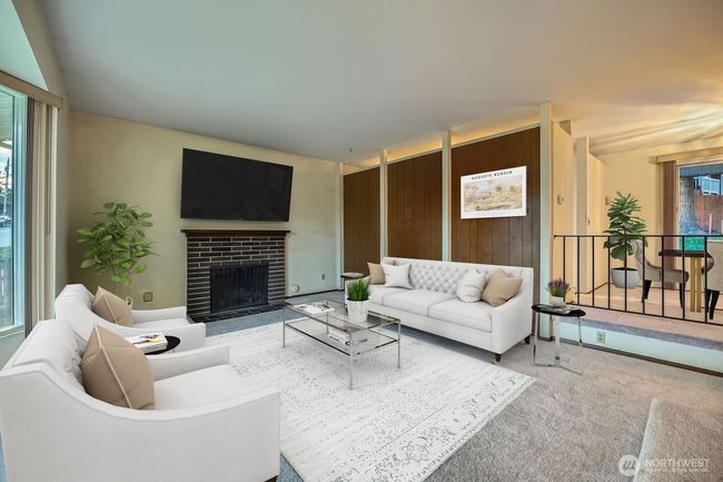 Large stepdown living room with wood burning fireplace and lots of natural light! | Image 8