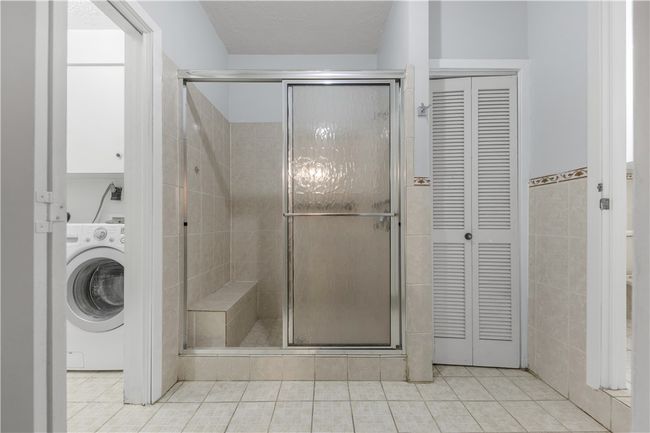 Bathroom with utility room entrance. | Image 16