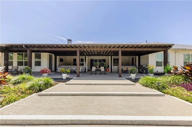 Back of house with stucco siding and a patio | Image 10
