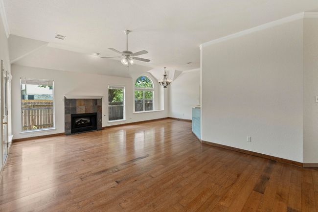 Second living area with gas fireplace & back yard access | Image 8