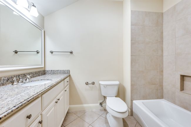 Bathroom featuring tile patterned floors and vanity | Image 13