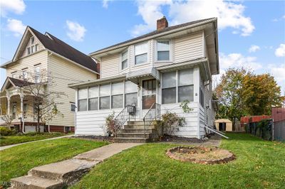 View of front of home featuring a front yard and a sunroom | Image 3