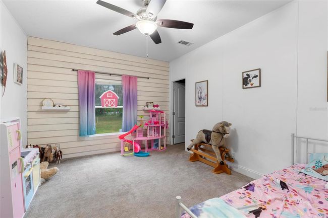 Bedroom 2 with walk-in closet overlooking the front yard | Image 22