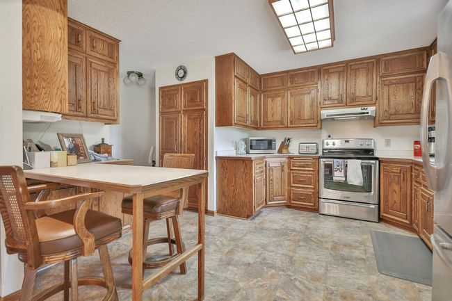 Peninsula eat-up counter and pantry. | Image 16
