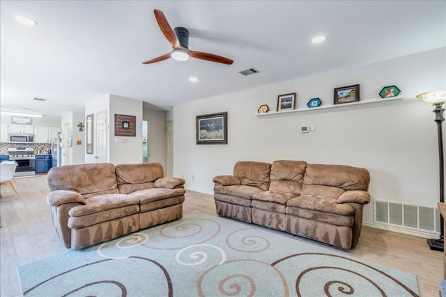 2nd Living room (Den) is located adjacent to the kitchen & breakfast area, and features newly installed can lighting! | Image 14