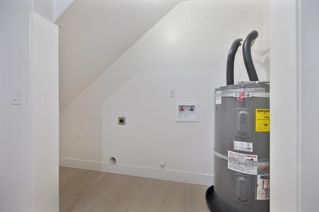 Laundry area inside attached storage room | Image 54