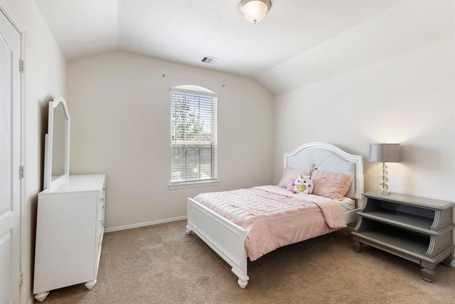 Light & bright secondary bedroom upstairs with a large walk in closet. | Image 34