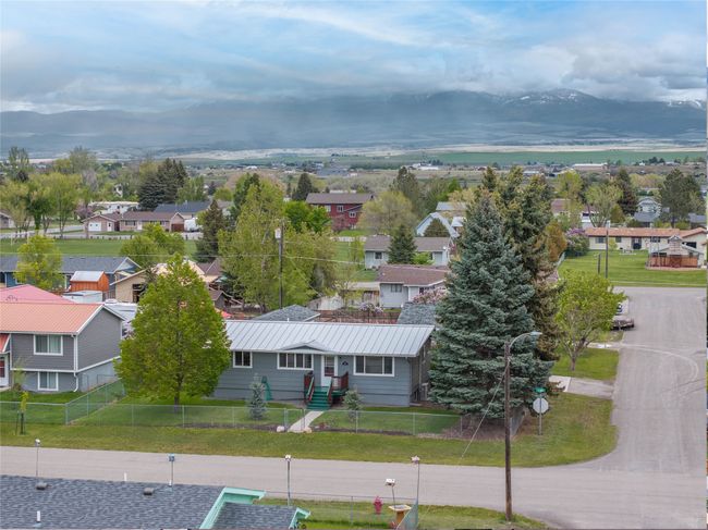 Aerial perspective of suburban area featuring a mountain backdrop | Image 42