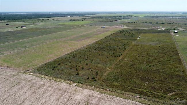 Aerial view of sparsely populated area with extensive farmland | Image 8