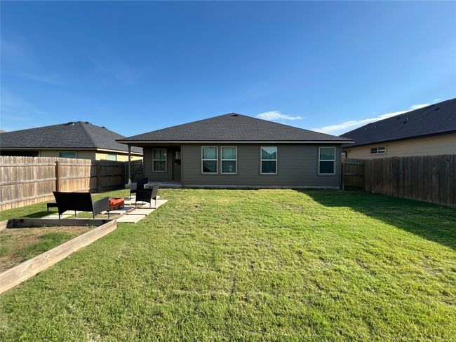 Rear view of house featuring a patio area and an outdoor fire pit | Image 5