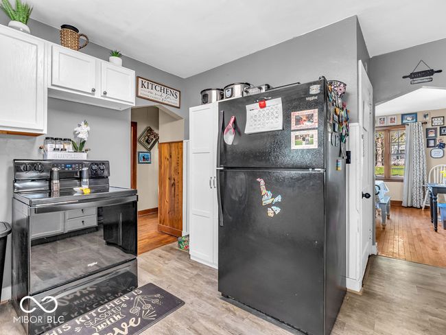 kitchen with black appliances | Image 11
