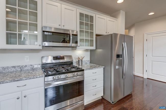 Gas range and glass cabinets. | Image 11