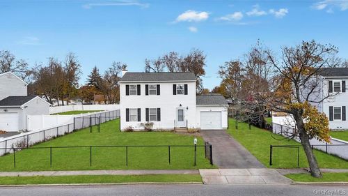 57 Macarthur Ave, Brentwood, NY, 11717-3404 | Card Image