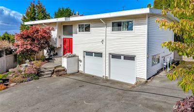 Oversized garage offers lots of area for a shop and storage. | Image 1