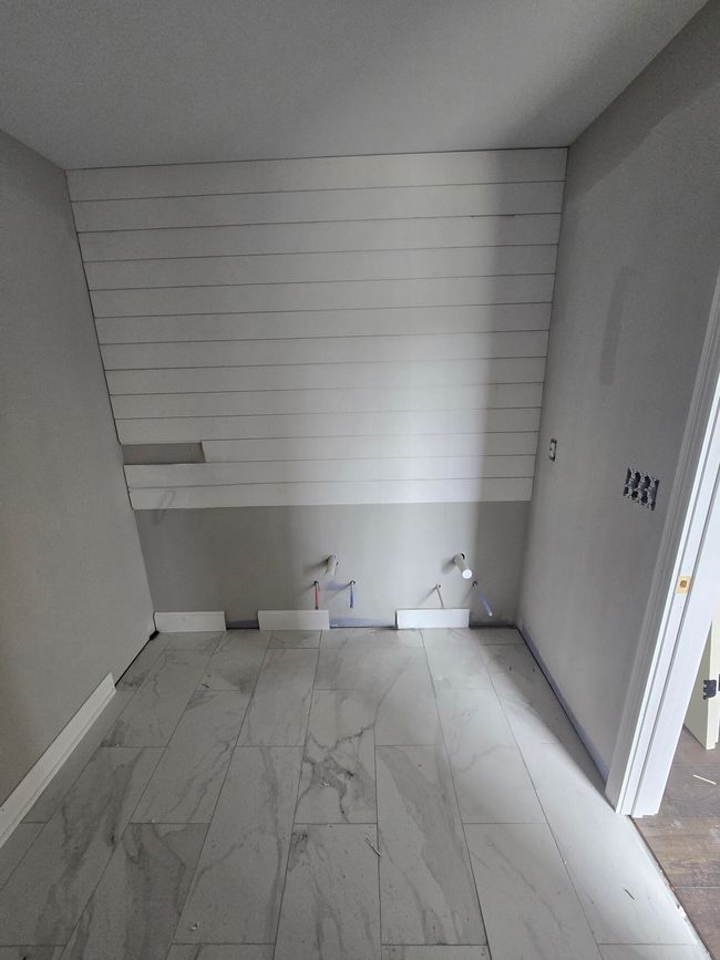 Dual granite top vanity with this gorgeous shiplap makes this bathroom a dream | Image 20