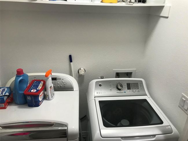 Laundry room featuring independent washer and dryer | Image 8
