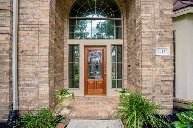 The front covered porch offers a place to greet your guests under the shelter, or receive your parcels in inclement weather. | Image 5